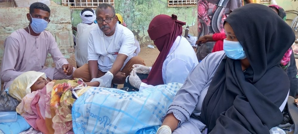 teams behandelen cholera-patient in Soedan
